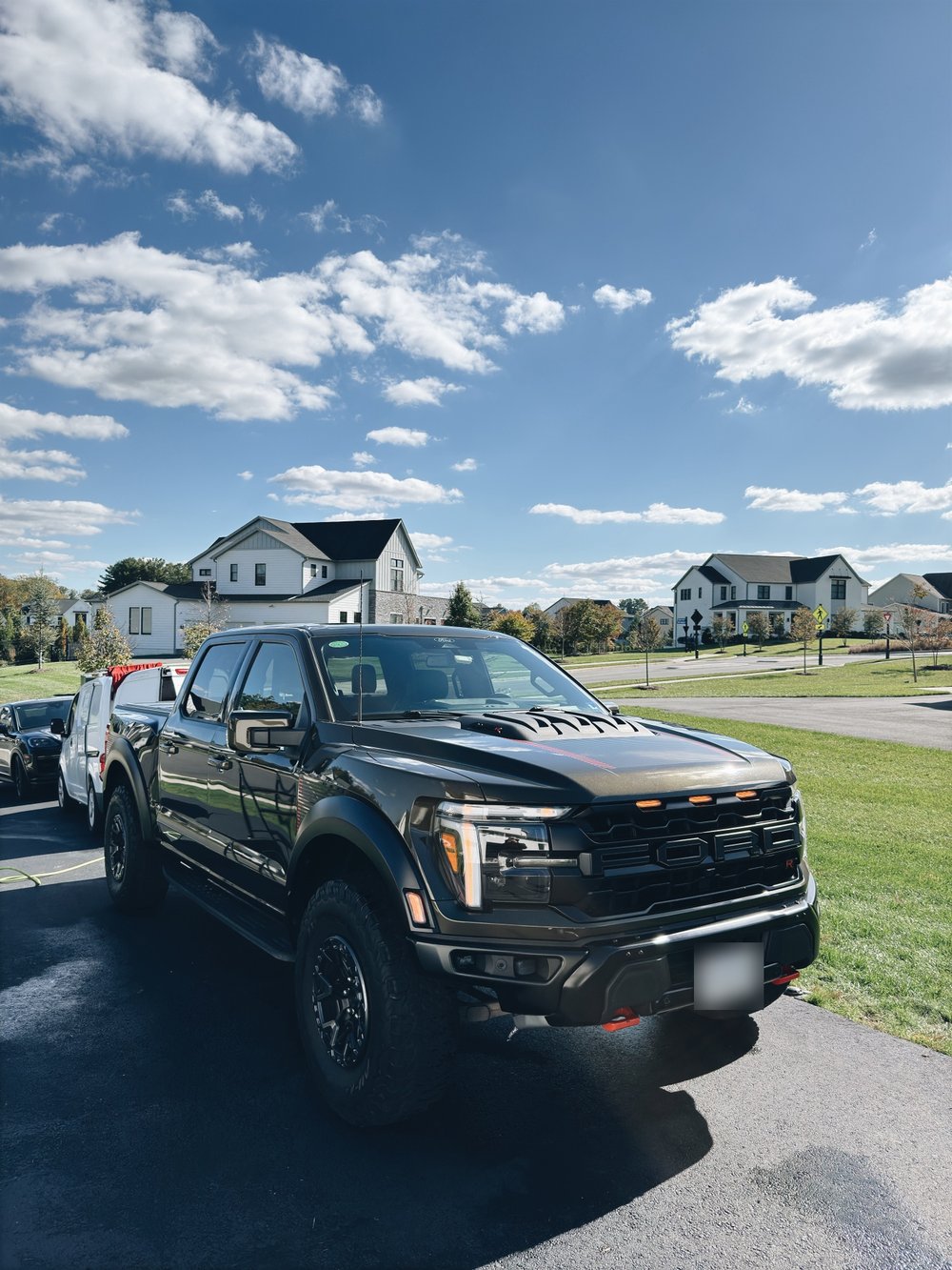 Black Ford F-150 Raptor R with a deep gloss finish after a detail