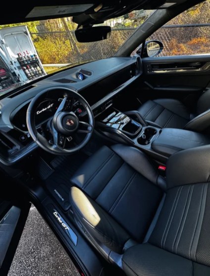 Clean black leather interior of a Porsche Cayenne Turbo GT